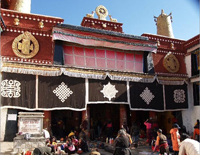 Entrance of Jokhang Temple with Pilgrims praying