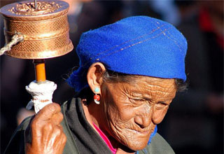Old Tibetan woman taking the Jokhang Circuit in Tibet