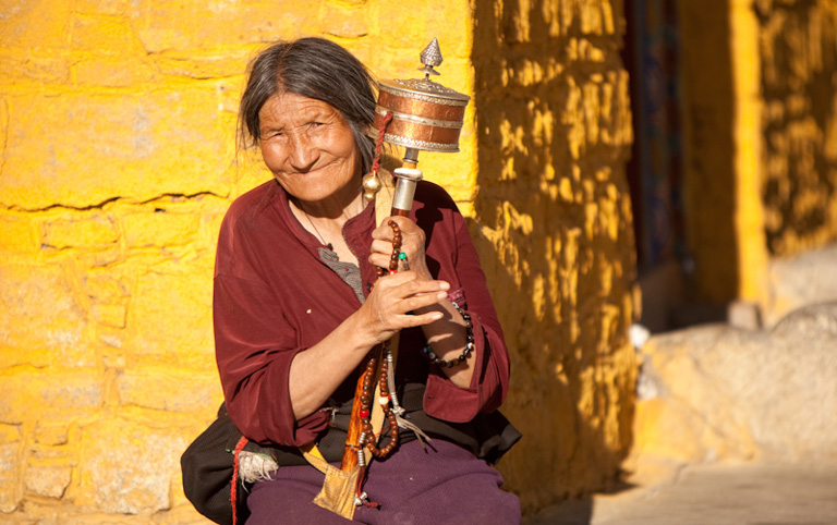 Old Tibetan Lady Welcomes with Smiles