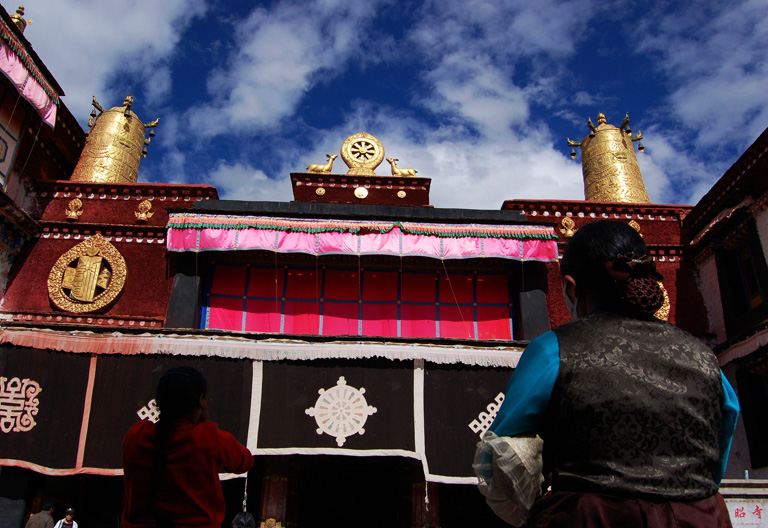 Pilgrims are prostrating in the Jokhang Monastery 