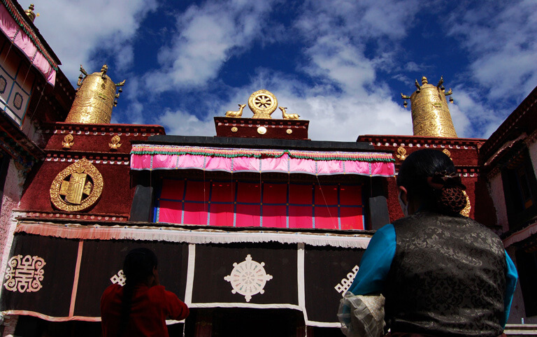 Pilgrims are prostrating in the Jokhang Monastery 